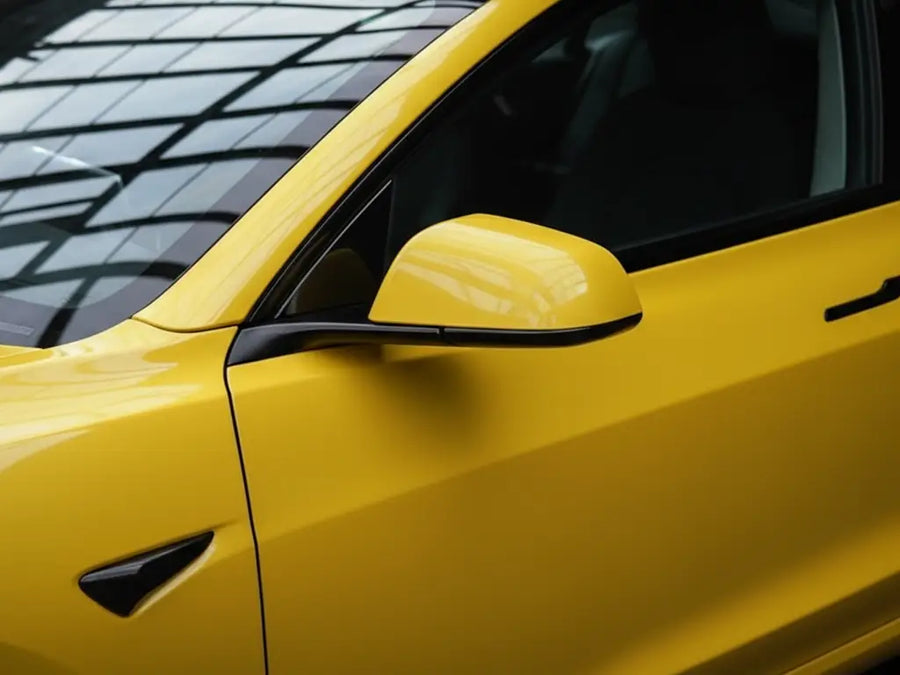 Tesla 3 wrapped in Gloss HX20000 Daffodil Yellow vinyl wrap HX20123B