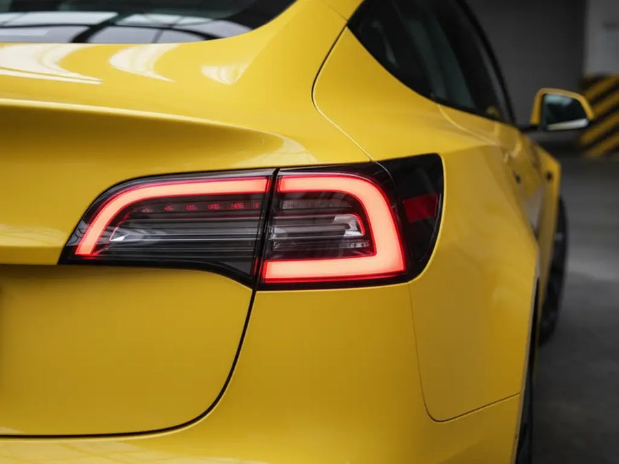 Tesla 3 wrapped in Hexis Gloss HX20000 Daffodil Yellow restyling film HX20123B