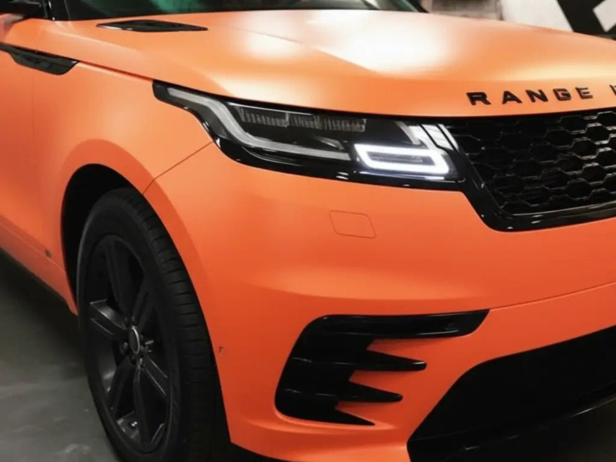 Range Rover Velar wrapped in Matte HX20000 Mandarin Red automotive vinyl film HX20165M