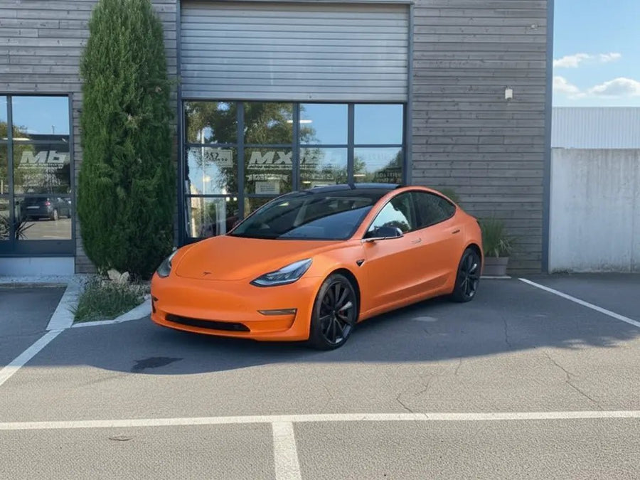 Tesla 3 wrapped in Matte HX20000 Mandarin Red automotive vinyl film HX20165M