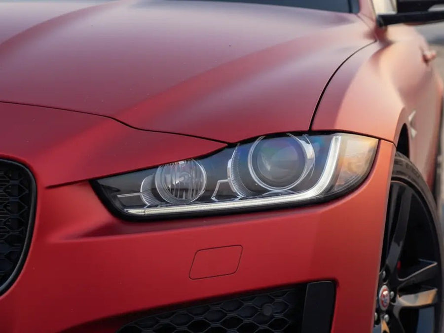 Jaguar XE wrapped in Satin HX20000 Red Aluminum vinyl wrap HX20196S