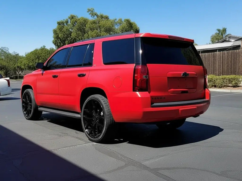 Chevrolet Tahoe wrapped in Hexis Matte HX20000 Blood Red restyling film HX20200M