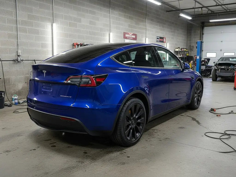 Tesla Y wrapped in Gloss HX20000 Night Blue restyling film HX20281B