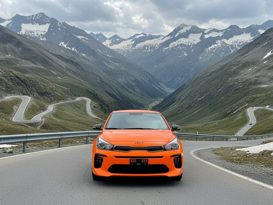 Kia Rio wrapped in Hexis Gloss HX20000 Fluorescent Orange restyling film HX20614B