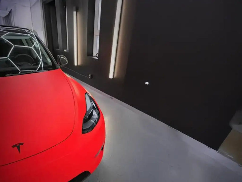 Tesla 3 wrapped in Hexis Satin HX20000 Fluorescent Red restyling film HX20615S