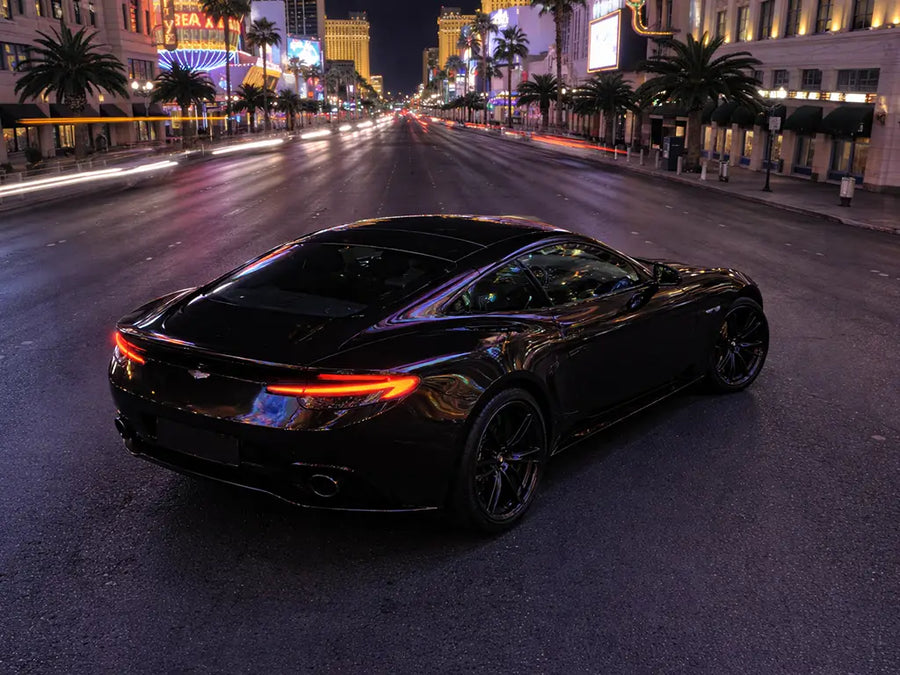 Aston Martin DB11 wrapped in Gloss HX20000 Coal Black automotive vinyl film HX20889B