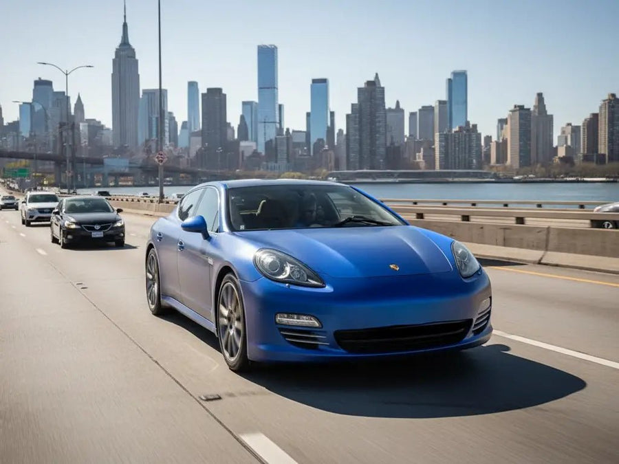 Porsche Panamera wrapped in Matte HX20000 Metallic Night Blue automotive vinyl film HX20905M