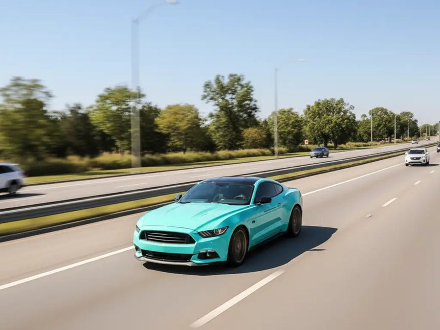 Ford Mustang wrapped in Hexis Gloss HX20000 Ti Blue restyling film HX20BTIB