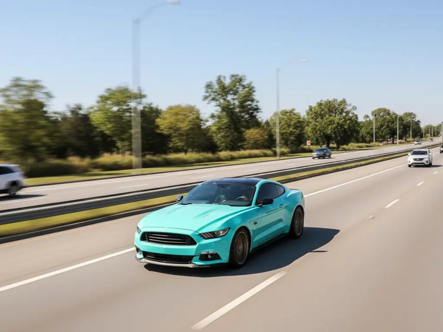 Ford Mustang wrapped in Hexis Gloss HX20000 Ti Blue restyling film HX20BTIB