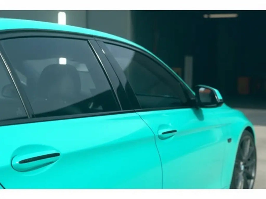 BMW 3 Series wrapped in Hexis Gloss HX20000 Ti Blue vinyl wrap HX20BTIB