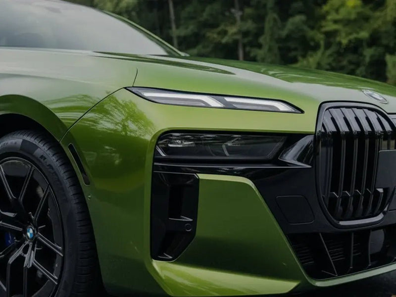 BMW 7 Series wrapped in Gloss HX20000 Fairway Green restyling film HX20VFAB