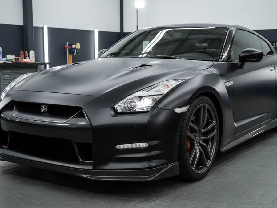 Nissan GT-R wrapped in Satin HX20000 Deep Black restyling film HX20NPRS