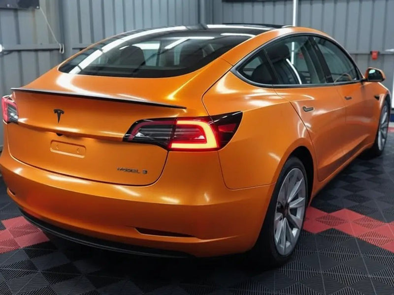 DIY Tesla 3 wrapped in Gloss HX20000 Aurora Orange restyling film HX20OAUB