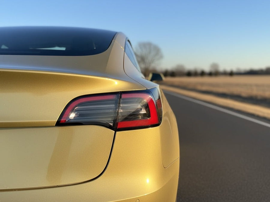 Tesla 3 wrapped in Hexis Gloss HX20000 Zeus Gold wrap film HX20P001