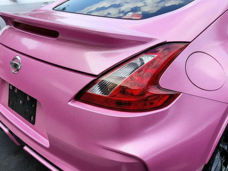 Nissan 370Z wrapped in Hexis Gloss HX20000 Jellybean Pink vinyl wrap HX20RDRB