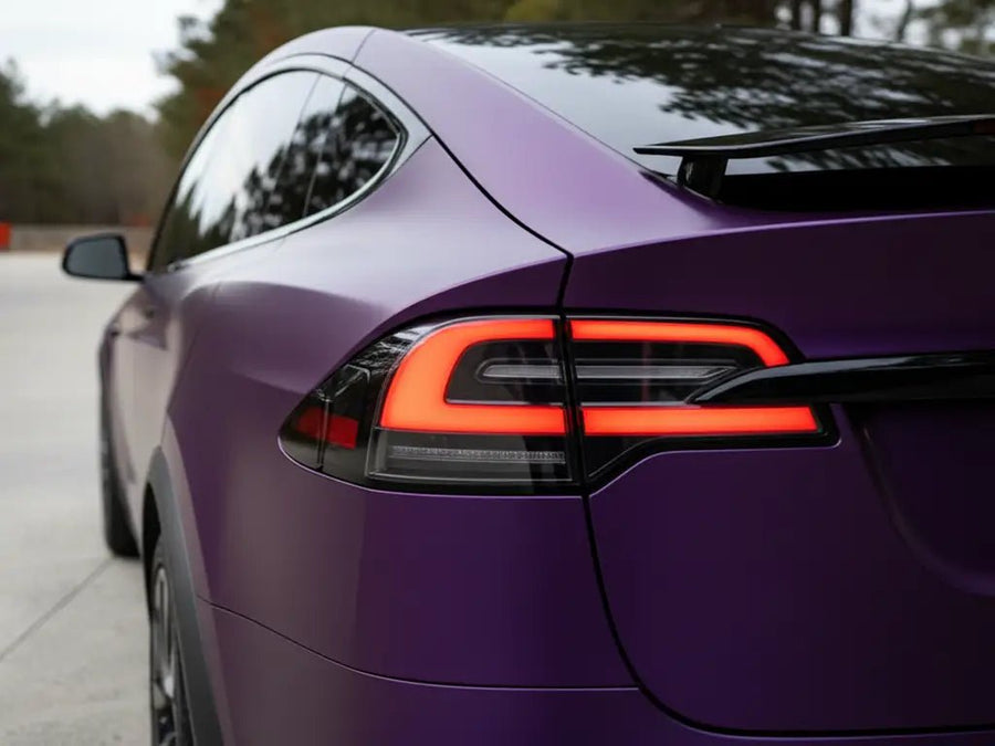 Tesla X wrapped in Hexis Satin HX20000 Deep Purple Wet automotive vinyl film HX20V43W