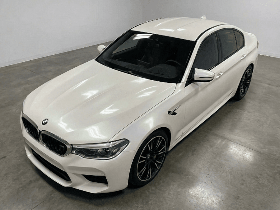 BMW M5 wrapped in Gloss HX30000 Nacre White restyling film HX30BNCB