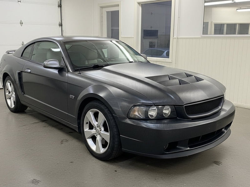 Ford Mustang GT wrapped in Gloss HX30000 Black Carbon Fiber automotive vinyl film HX30CA890B