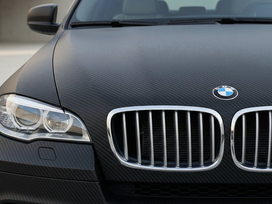 BMW X5 wrapped in Hexis Matte HX30000 Raven Black Carbon Fiber restyling film HX30CANCOB