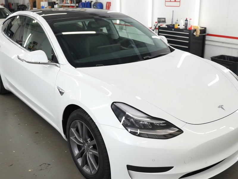 Tesla 3 wrapped in Gloss HX30000 Black Carbon One Carbon Fiber car wrap film HX30CANPEB