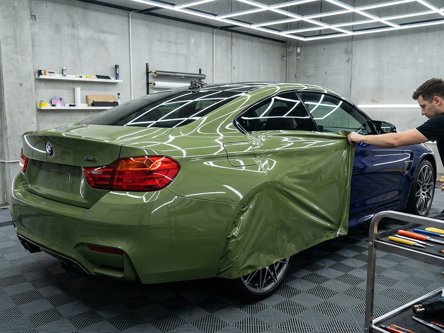 BMW M4 wrapped in Super Gloss HXONE™ Vintage Green automotive vinyl film HXONE700