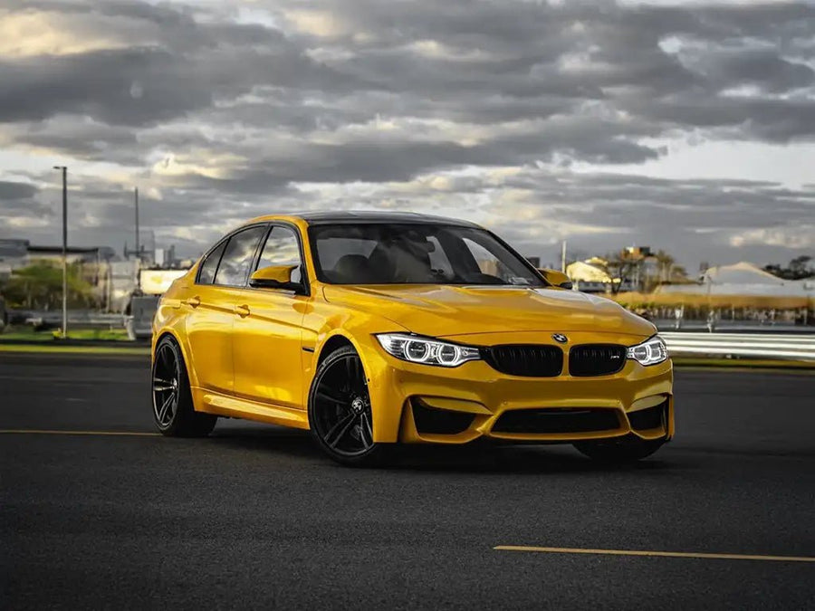 BMW M3 wrapped in SuperGloss Metallic Dandelion Yellow restyling film