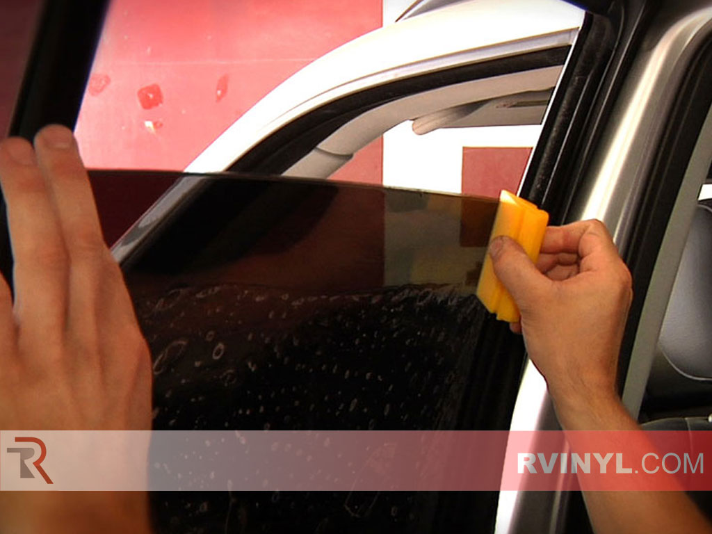 Window Tint Film Sheet Installation Using a Squeegee