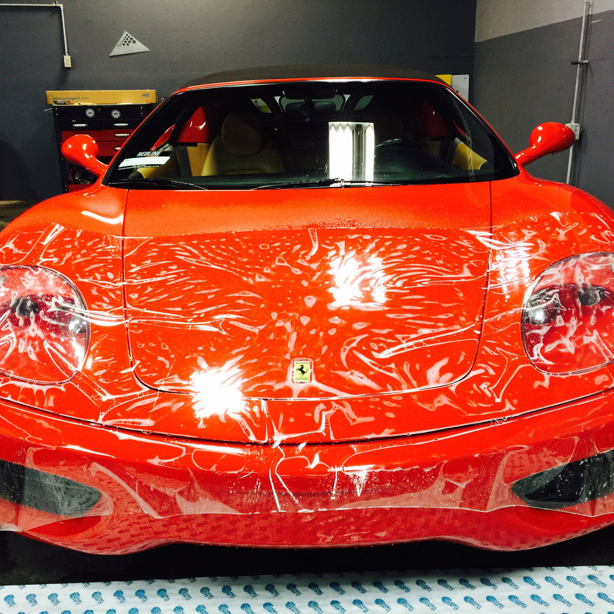 Clear bra paint protection film being applied to a vehicle on the Rvinyl clear bras collection page