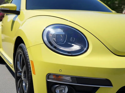 Volkswagen Beetle wrapped in Hexis Gloss HX20000 Lemon Yellow vinyl wrap HX20108B