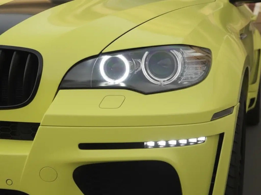 BMW X6 wrapped in Hexis Gloss HX20000 Lemon Yellow restyling film HX20108B