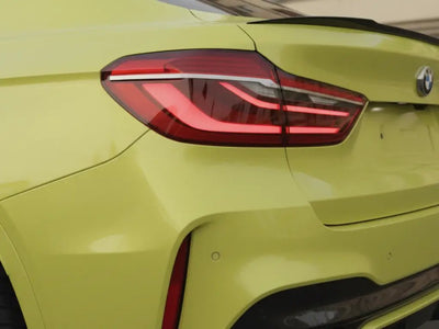 BMW M4 wrapped in Hexis Gloss HX20000 Lemon Yellow wrap film HX20108B