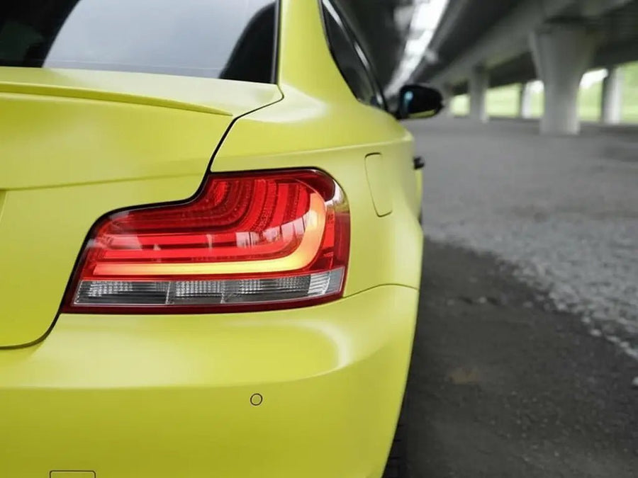 BMW 1 Series wrapped in Hexis Matte HX20000 Lemon Yellow restyling film HX20108M