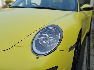 Porsche 911 wrapped in Matte HX20000 Lemon Yellow restyling film HX20108M