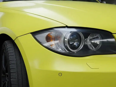 BMW 3 Series wrapped in Hexis Matte HX20000 Lemon Yellow car wrap film HX20108M