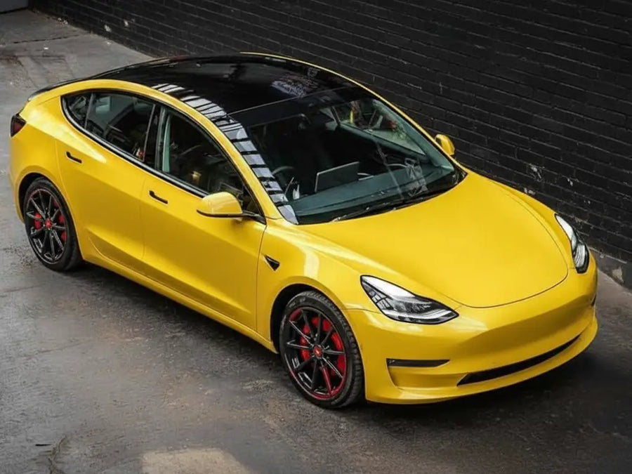 Tesla 3 wrapped in Hexis Gloss HX20000 Daffodil Yellow vinyl wrap HX20123B