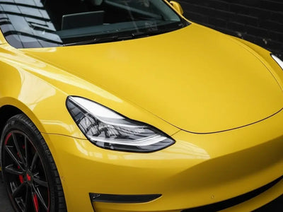 Tesla 3 wrapped in Gloss HX20000 Daffodil Yellow automotive vinyl film HX20123B