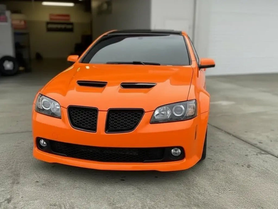 Pontiac G8 wrapped in Hexis Gloss HX20000 Orange Red restyling film HX20165B