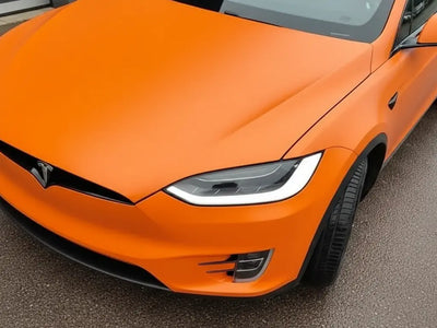 Tesla X wrapped in Matte HX20000 Mandarin Red restyling film HX20165M