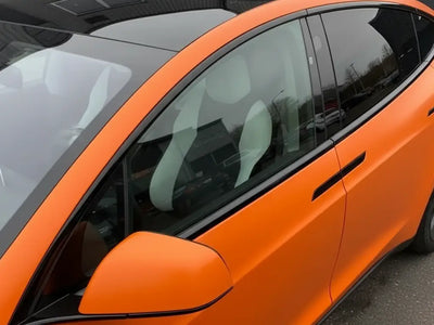 Tesla X wrapped in Matte HX20000 Mandarin Red car wrap film HX20165M
