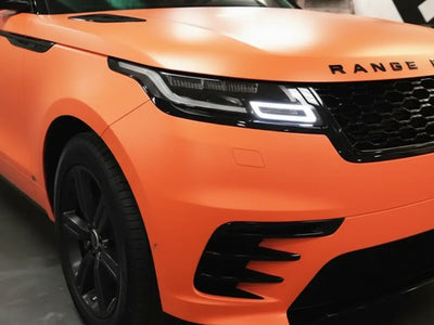 Range Rover Velar wrapped in Matte HX20000 Mandarin Red automotive vinyl film HX20165M