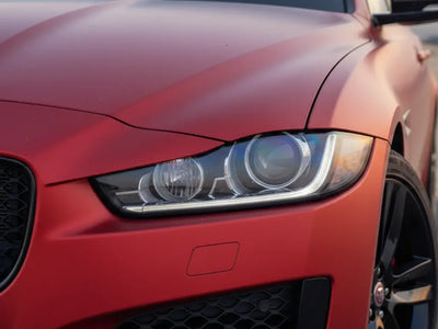 Jaguar XE wrapped in Satin HX20000 Red Aluminum vinyl wrap HX20196S