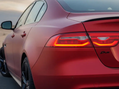 Jaguar XE wrapped in Hexis Satin HX20000 Red Aluminum car wrap film HX20196S