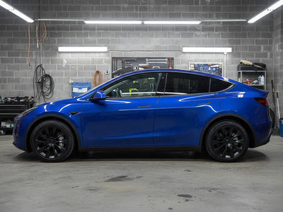 Tesla Y wrapped in Gloss HX20000 Night Blue automotive vinyl film HX20281B