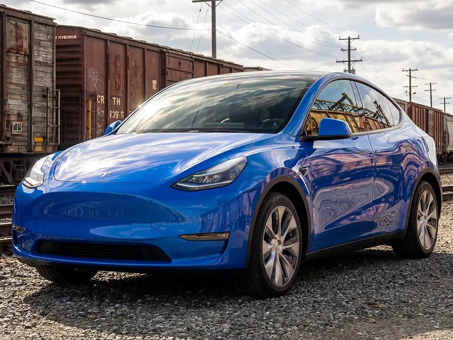 Tesla Y wrapped in Hexis Gloss HX20000 Intense Blue restyling film HX20293B