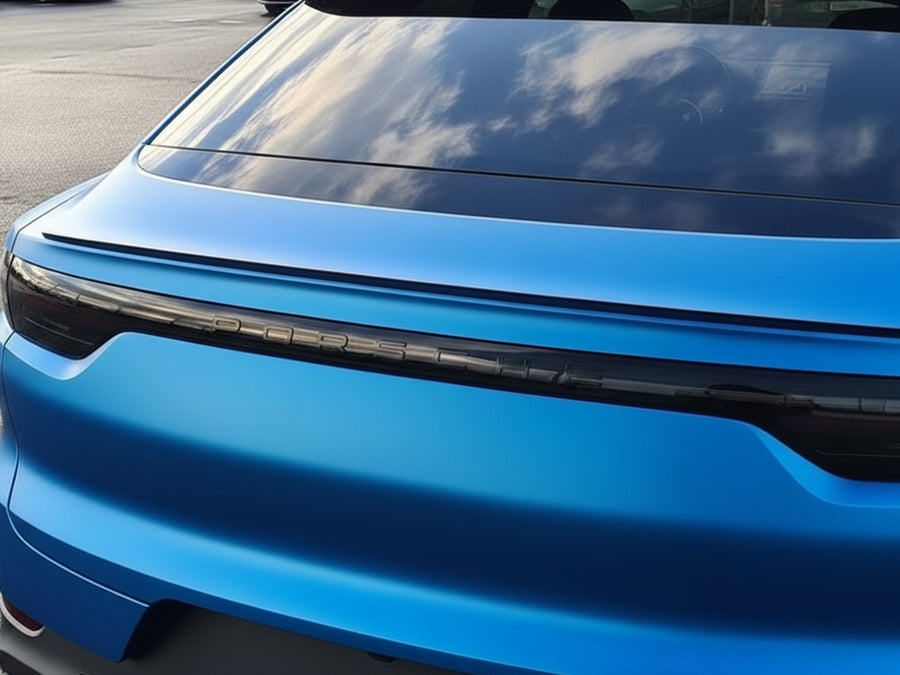 Porsche Taycan wrapped in Satin HX20000 Racing Light Blue car wrap film HX20521S