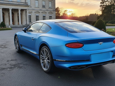 Bentley Continental GT wrapped in Satin HX20000 Racing Light Blue restyling film HX20521S