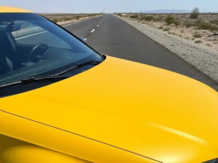 Car wrapped in Matte HX20000 Yellow Florida wrap film HX20548M