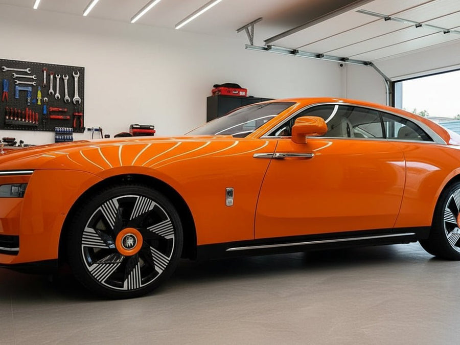 Rolls-Royce Spectre wrapped in Gloss HX20000 Orange Zenith wrap film HX20585B