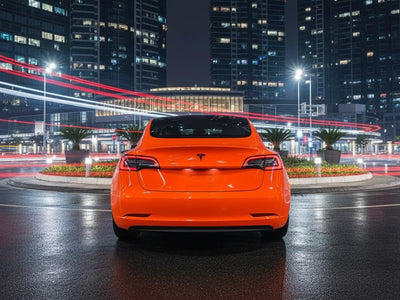 Tesla 3 wrapped in Hexis Gloss HX20000 Fluorescent Orange automotive vinyl film HX20614B