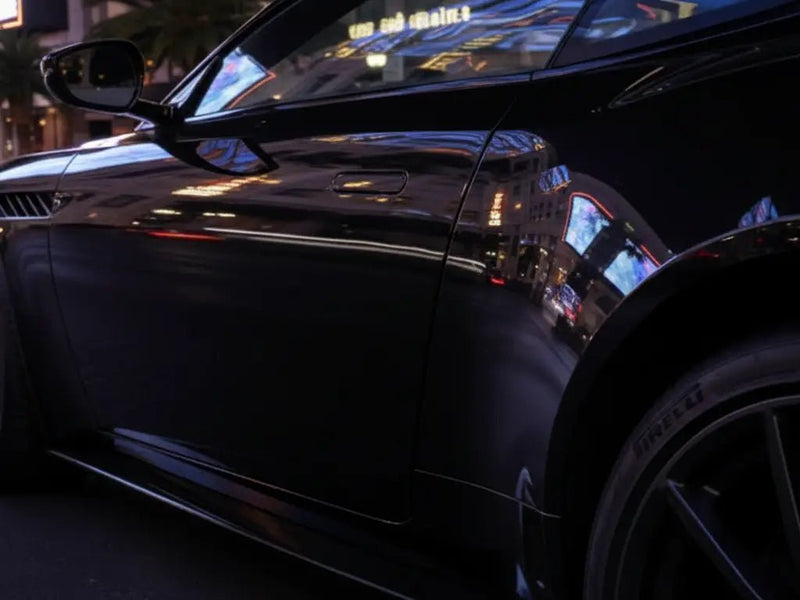 Car wrapped in Hexis Gloss HX20000 Coal Black automotive vinyl film HX20889B